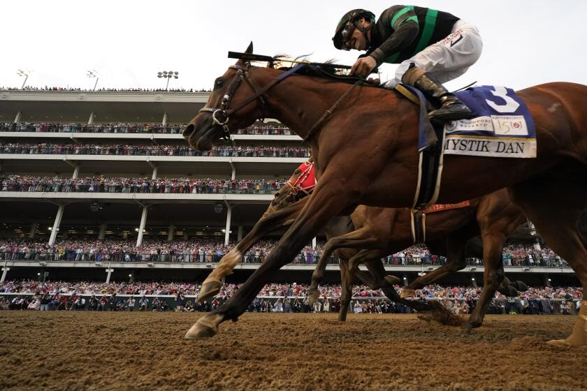Brian Hernandez Jr. rides Mystik Dan across the finish line to win the 150th running of the Kentucky Derby horse race at Churchill Downs Saturday, May 4, 2024, in Louisville, Ky. (AP Photo/Jeff Roberson)