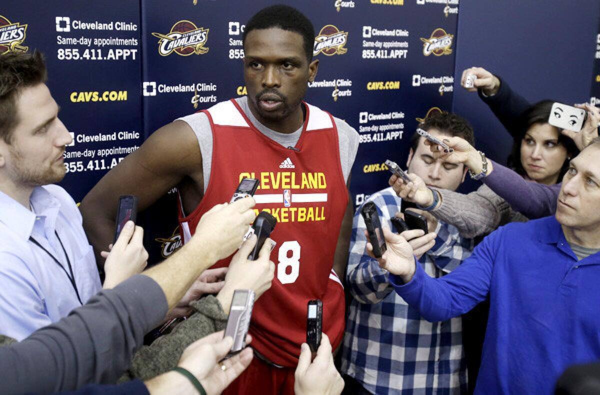 Newly acquired forward Luol Deng talks to reporters after his first practice with the Cleveland Cavaliers.