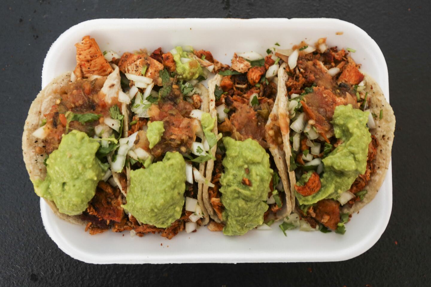 Chicken tacos with cilantro, onions and avocado from Carlos's Tijuana Tacos, a new taco vendor in Whittier.