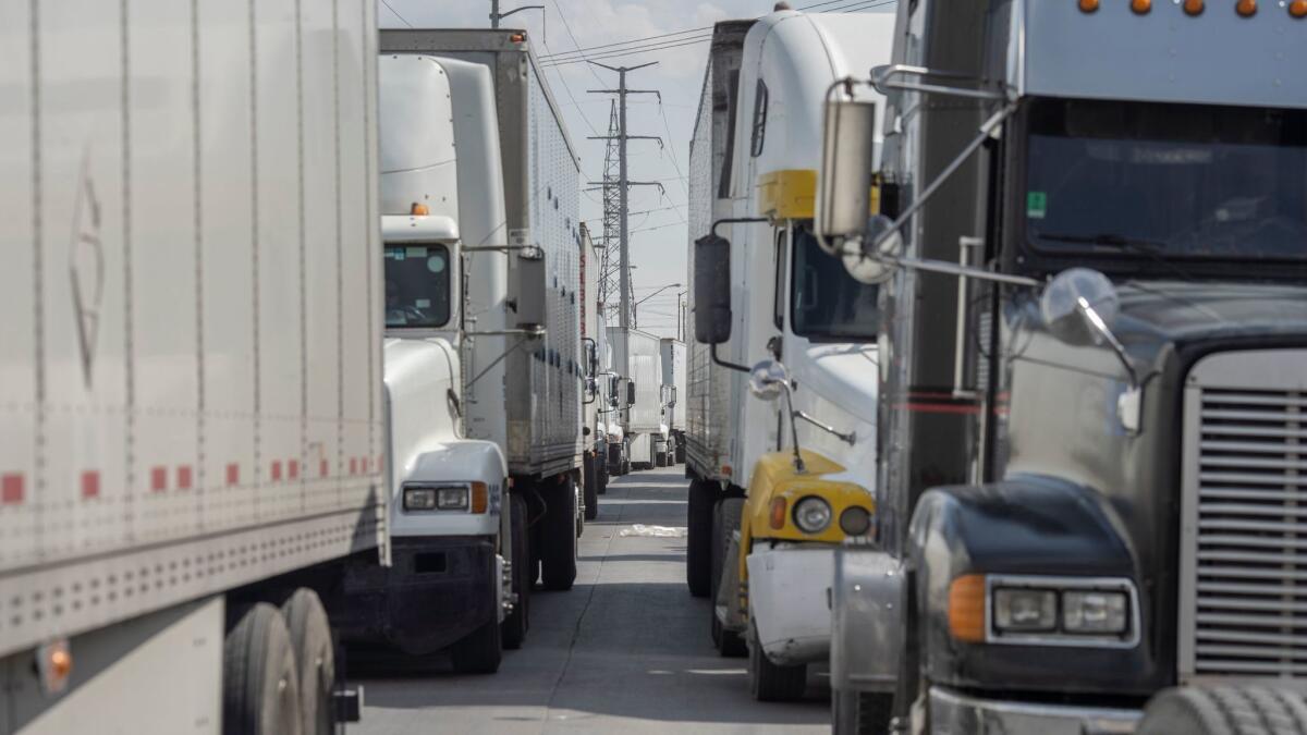 Trucks wait for inspection before crossing the border at the Zaragoza International Bridge in Juarez, Mexico, across the border from El Paso.