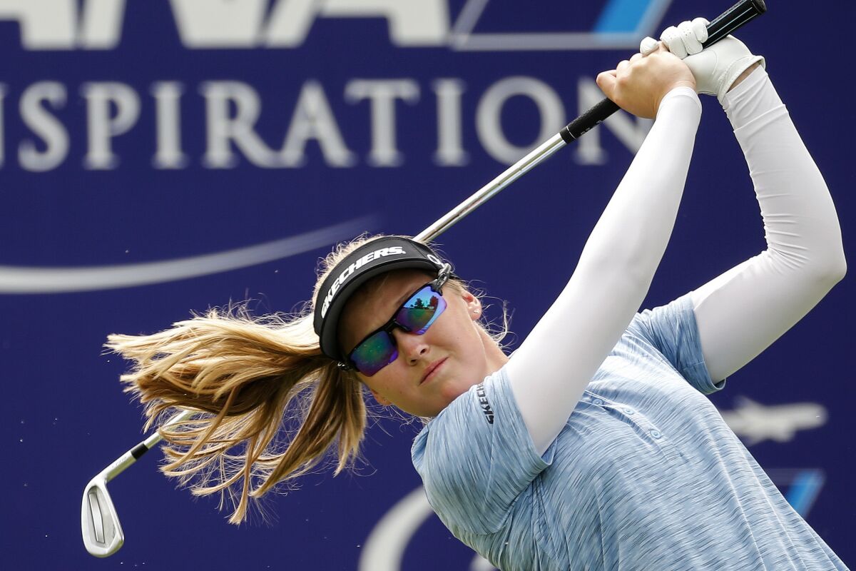 Brooke M. Henderson watches her tee shot on the 17th hole during the third round of the LPGA's ANA Inspiration golf tournament at Mission Hills Country Club in Rancho Mirage, Calif., Saturday Sept. 12, 2020. (AP Photo/Ringo H.W. Chiu)