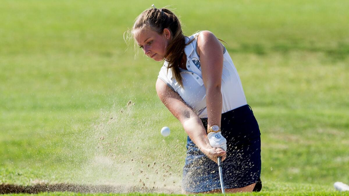 Corona del Mar's Sydney Sharf hits out of the sand during Thursday's match. Sharf shot a 46 for the Sea Kings.