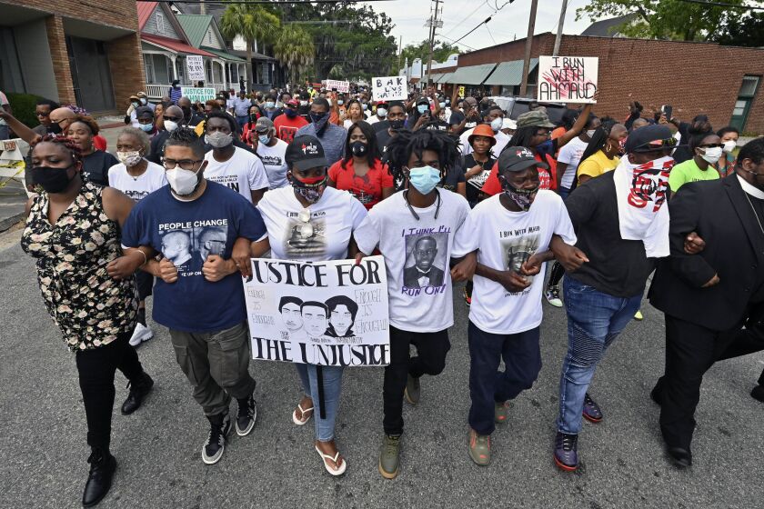 Protesters march after a rally at the Glynn County Courthouse to protest the shooting of Ahmaud Arbery, Saturday, May 16, 2020, in Brunswick, Ga. (Hyosub Shin/Atlanta Journal-Constitution via AP)