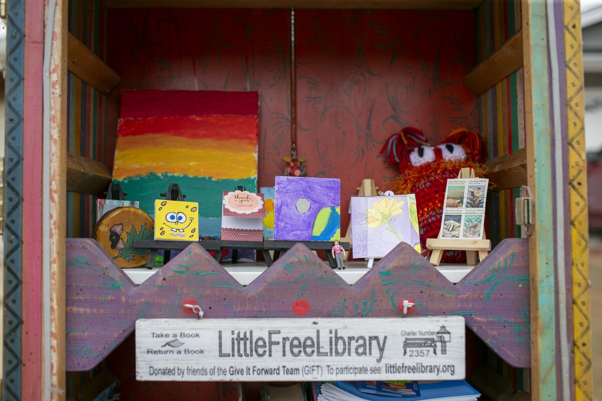 Charlene Ashendorf's Little Free Library recently evolved to include a small art gallery.