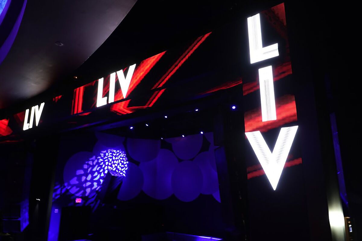 FILE - Lights are illuminated at an empty LIV nightclub Wednesday, Oct. 14, 2020, in Miami Beach, Fla. LIV is offering free COVID-19 vaccines outside the Miami club where high rollers spend up to $20,000 just for a table. The start-studded nightclub set up pop-up COVID vaccine sites over the weekend at LIV and club Story to entice the young demographic that is rapidly filling up Florida hospitals as the delta variant rapidly spreads across Florida. (AP Photo/Lynne Sladky, file)