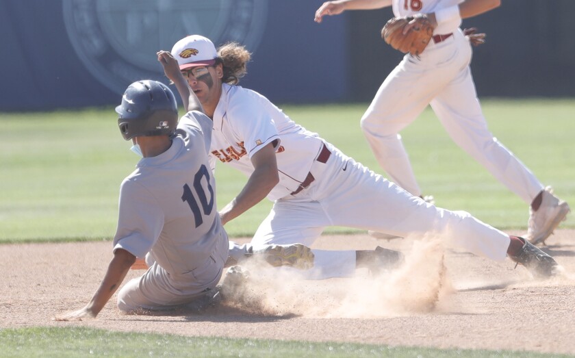 Estancia shortstop Jack Moyer (8) tags out the Mendez runner stealing second base on Tuesday.