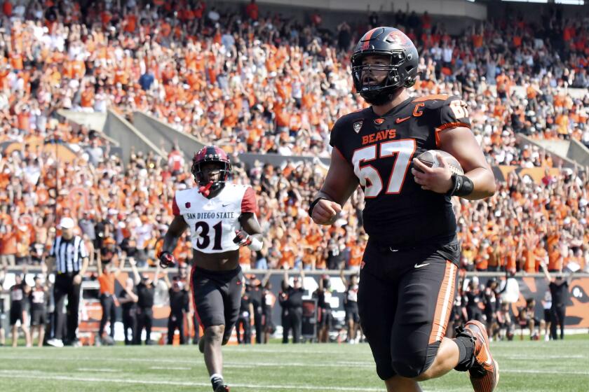 Oregon State offensive lineman Joshua Gray (67) rushes for a 3-yard touchdown during the first half of an NCAA college football game against San Diego State, Saturday, Sept. 16, 2023, in Corvallis, Ore. (AP Photo/Mark Ylen)