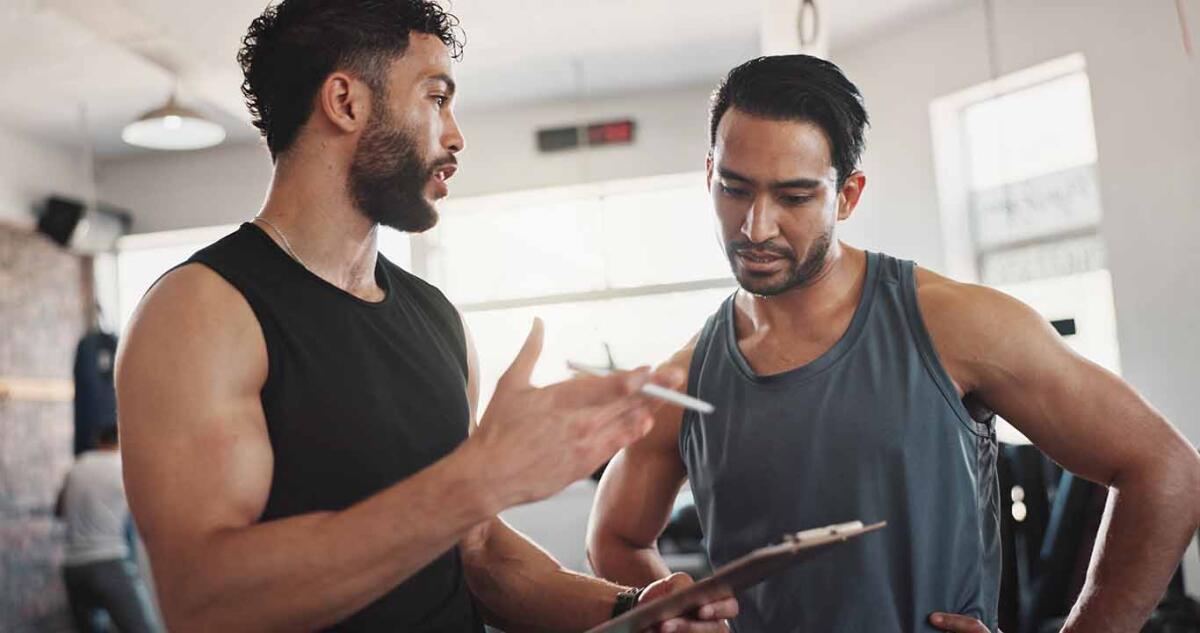 Fitness, advice and men in gym with clipboard for registration, sign up or workout schedule.