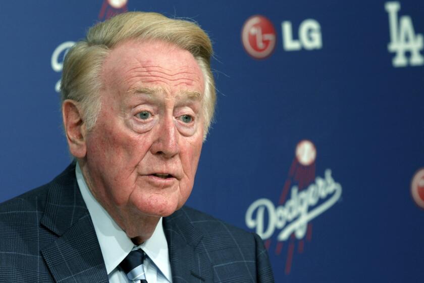 Longtime Dodgers broadcaster Vin Scully has dismissed Los Angeles Mayor Eric Garcetti's idea of naming a street after him.