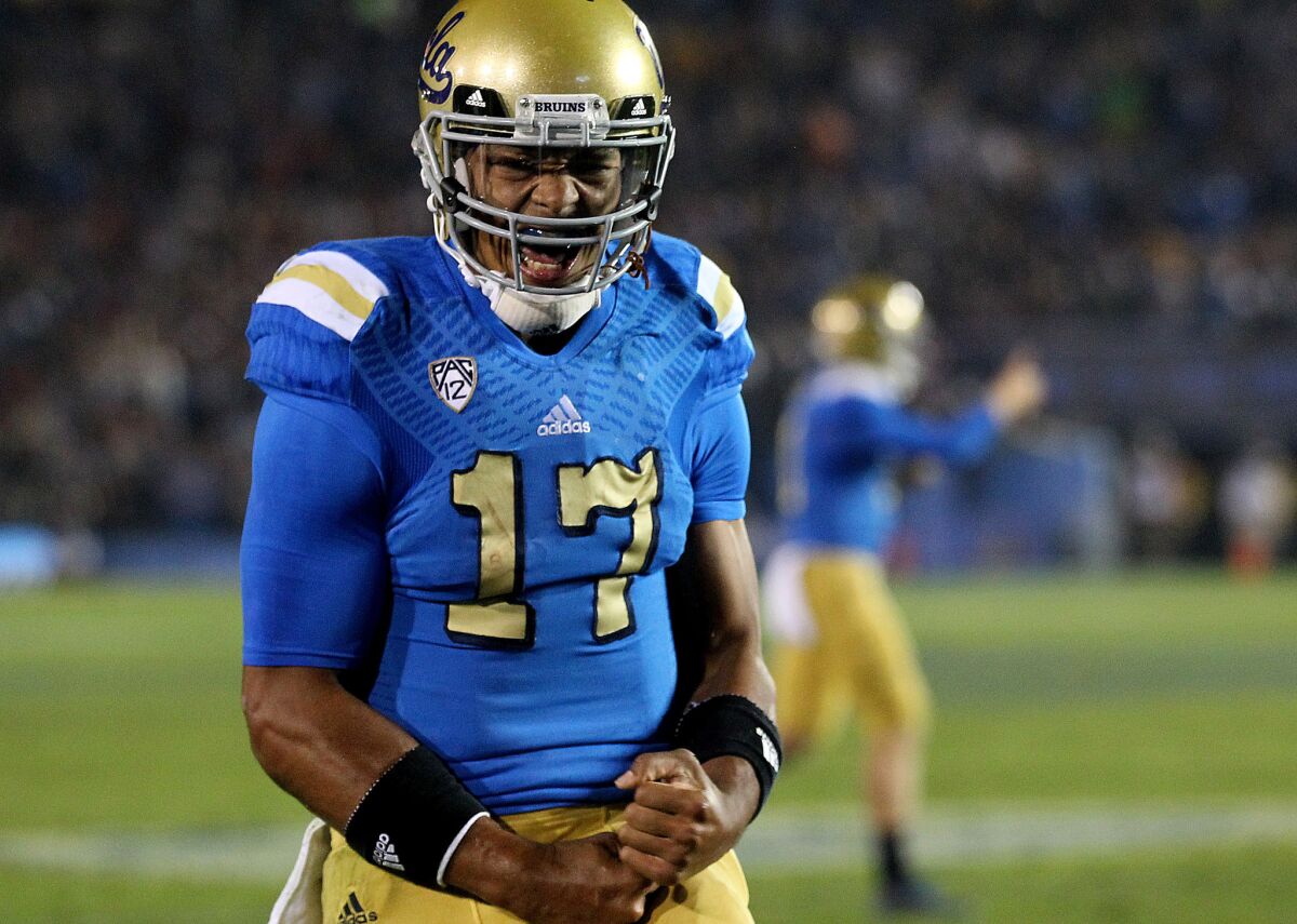 UCLA quarterback Brett Hundley passed for 326 yards and three touchdowns in the Bruins' 38-20 victory over the Trojans on Saturday night at the Rose Bowl.