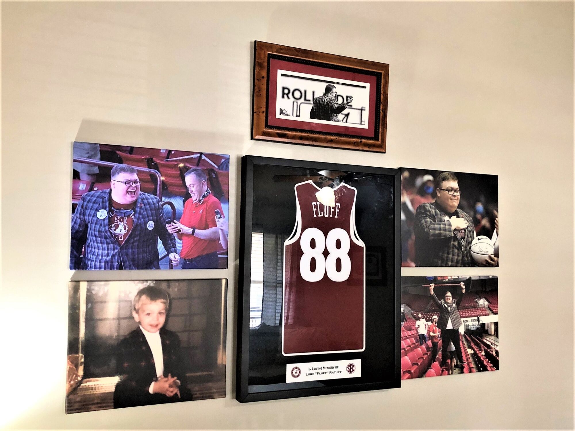 A "Fluff" jersey is framed on the wall with photos of Luke Ratliff.