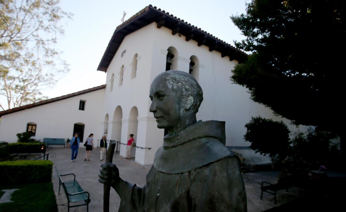 A statue of Father Junípero Serra at Mission San Luis Obispo de Tolosa .