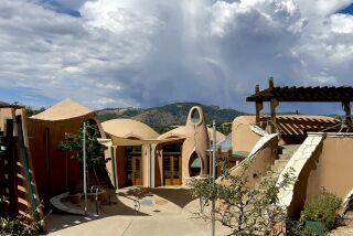 Thunderhead clouds over artist James Hubbell's Ilan-Lael Foundation headquarters in Santa Ysabel.