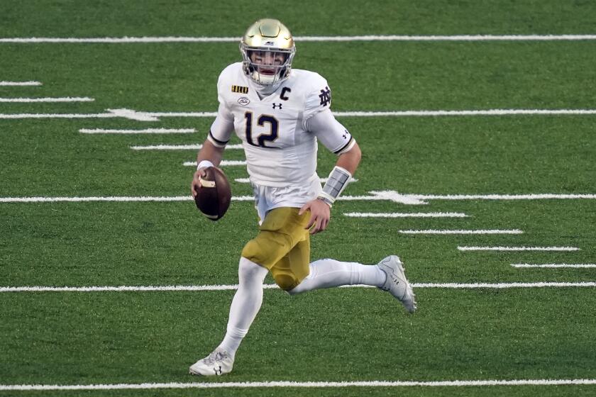 Notre Dame quarterback Ian Book scrambles during the Fighting Irish's win at North Carolina on Nov. 27, 2020.