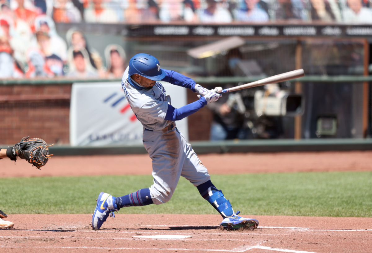 Dodgers right fielder Mookie Betts hits against the San Francisco Giants on Aug. 27.