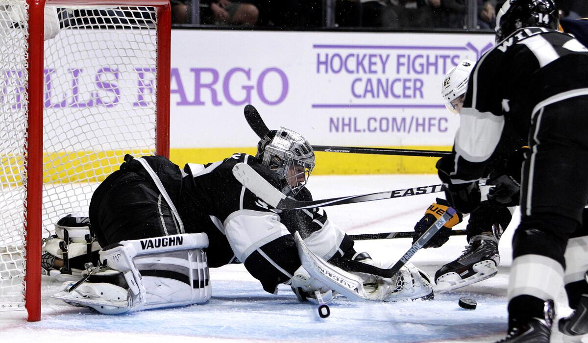 Kings goalie Jonathan Quick makes a save on a shot by Sabres left wing Marcus Foligno in the second period Thursday night at Staples Center.
