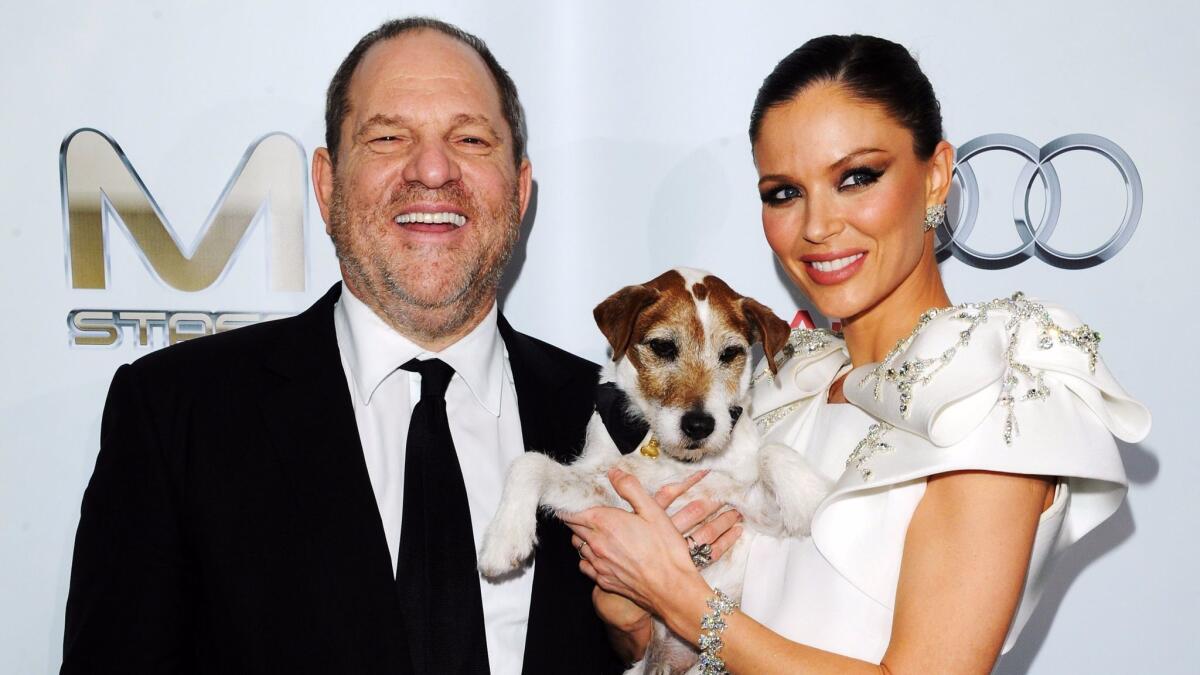 Harvey Weinstein, Uggie the dog and Georgina Chapman attend Weinstein Co.'s Oscar after-party at SkyBar at the Mondrian Los Angeles on Feb. 26, 2012 in West Hollywood.