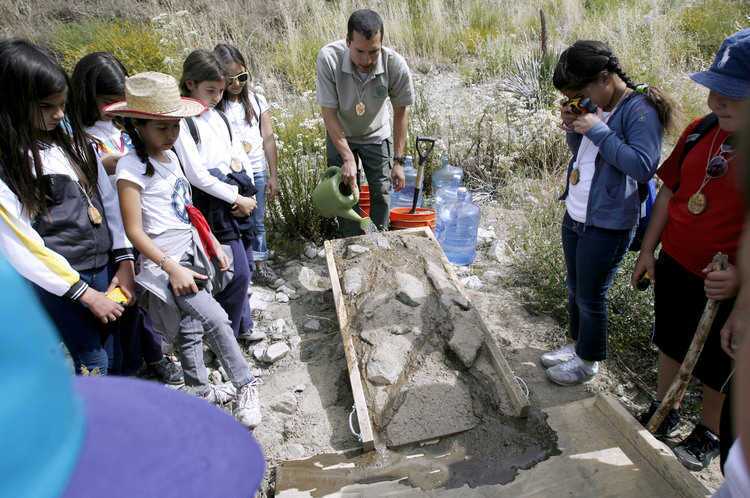 Park naturalist Dave Moreno shows Jefferson Elementary School 4th graders how erosion works at Deukmejian Wilderness Park in Glendale on Thursday, June 2, 2011. The all-day visit to the park was part of the Walk on the Wild Side nature education program. Students visited stations where they learned about life and earth sciences.