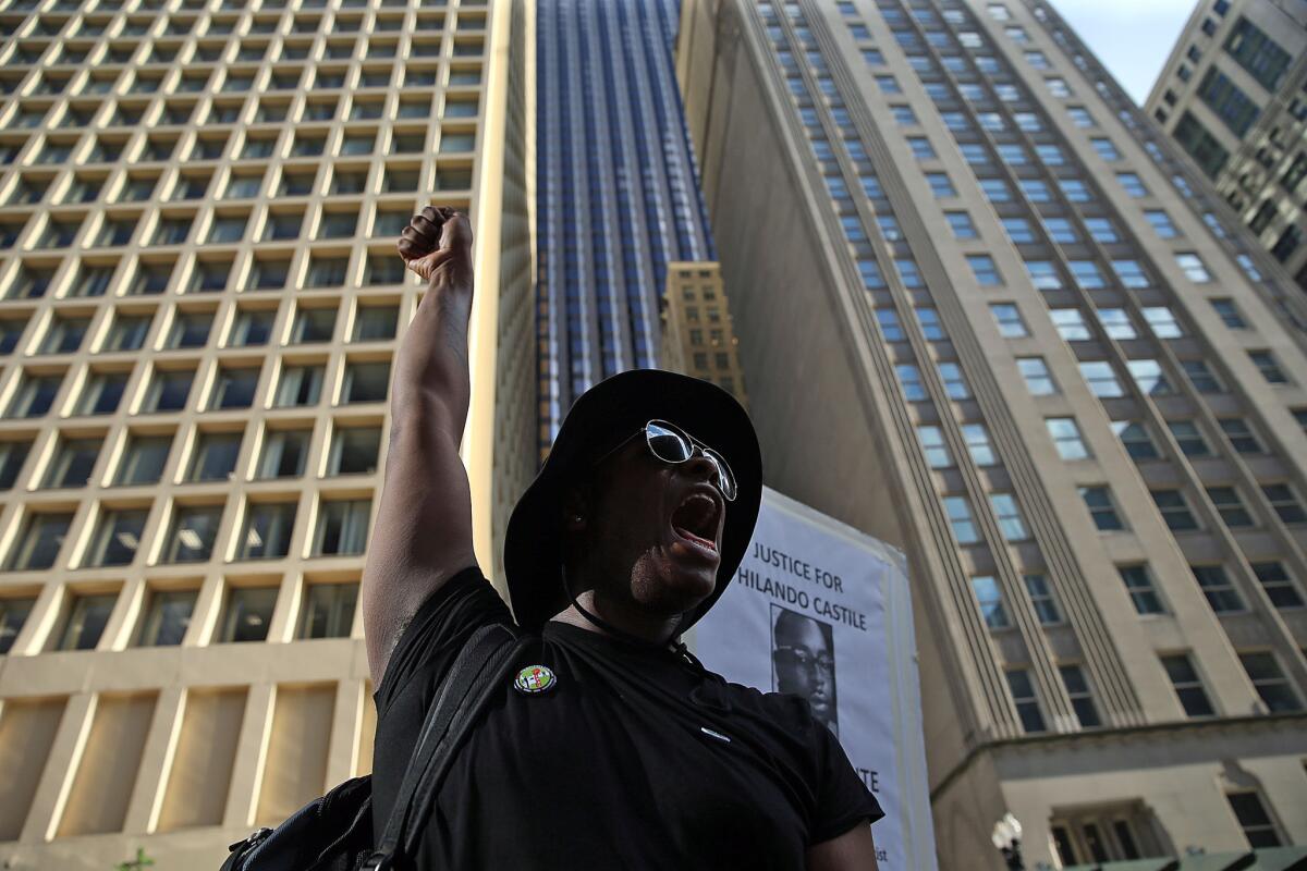 Michael Murphy yells out during a rally against police brutality on July 11, 2016, in downtown Chicago. Black Lives Matter Chicago, the Chicago Alliance Against Racist and Political Repression and Trinity United Church of Christ were among the organizations participating in the rally.