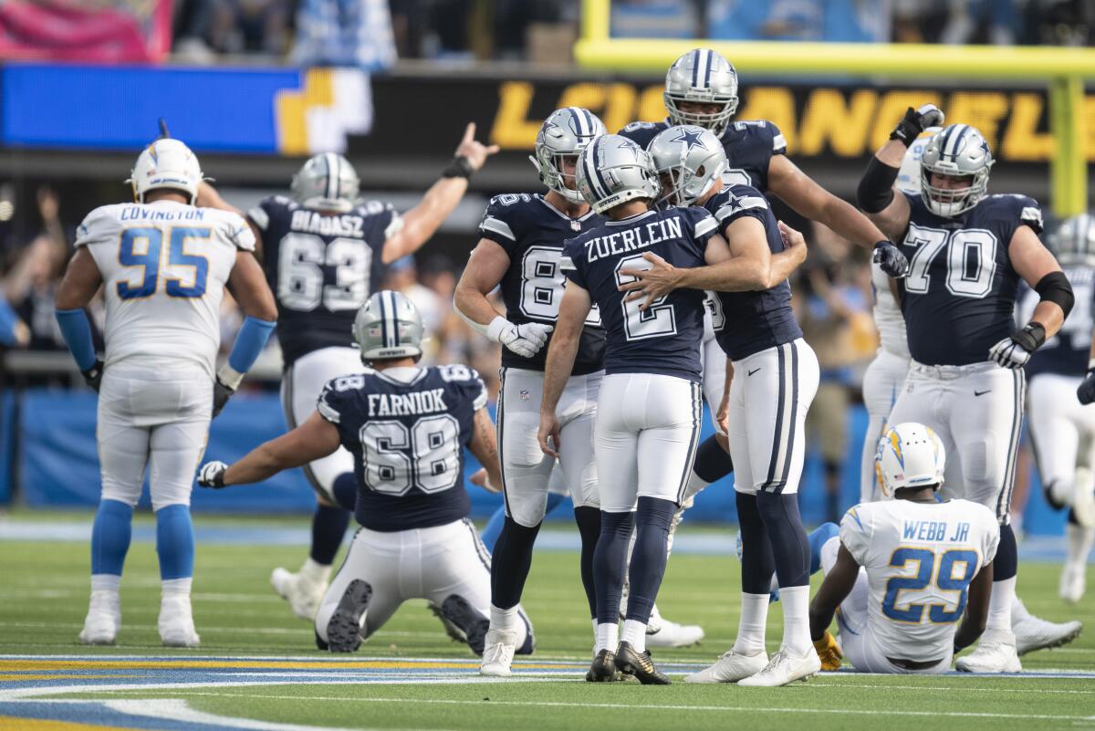 Dallas Cowboys team celebrate the game-winning field 