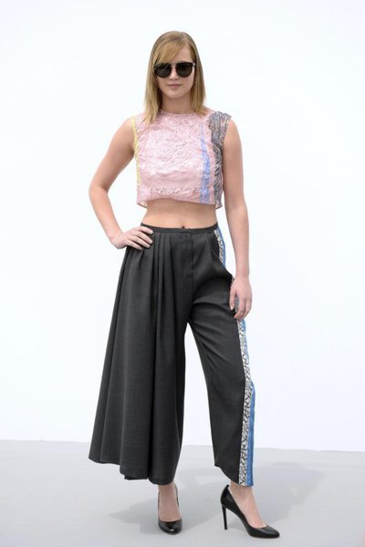 Jennifer Lawrence shows off a pair of interesting Dior pants as she attends the Christian Dior haute couture autumn/winter 2013-2014 show in Paris.