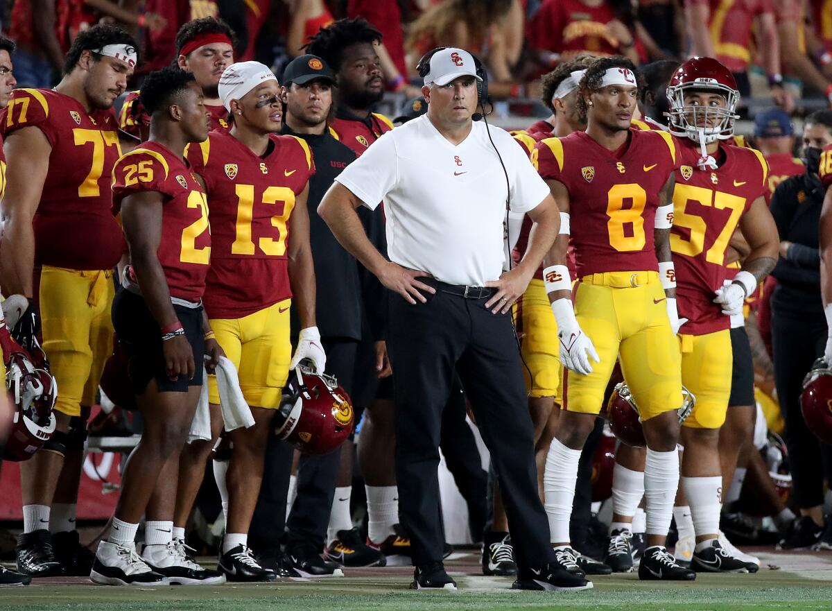 USC coach Clay Helton stands on the sideline at the Coliseum during Saturday's loss to Stanford.