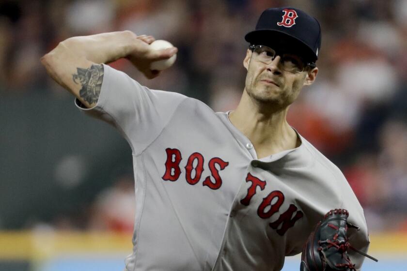 Boston Red Sox relief pitcher Joe Kelly throws against the Houston Astros during the fifth inning in Game 4 of a baseball American League Championship Series on Wednesday, Oct. 17, 2018, in Houston. (AP Photo/Frank Franklin II)