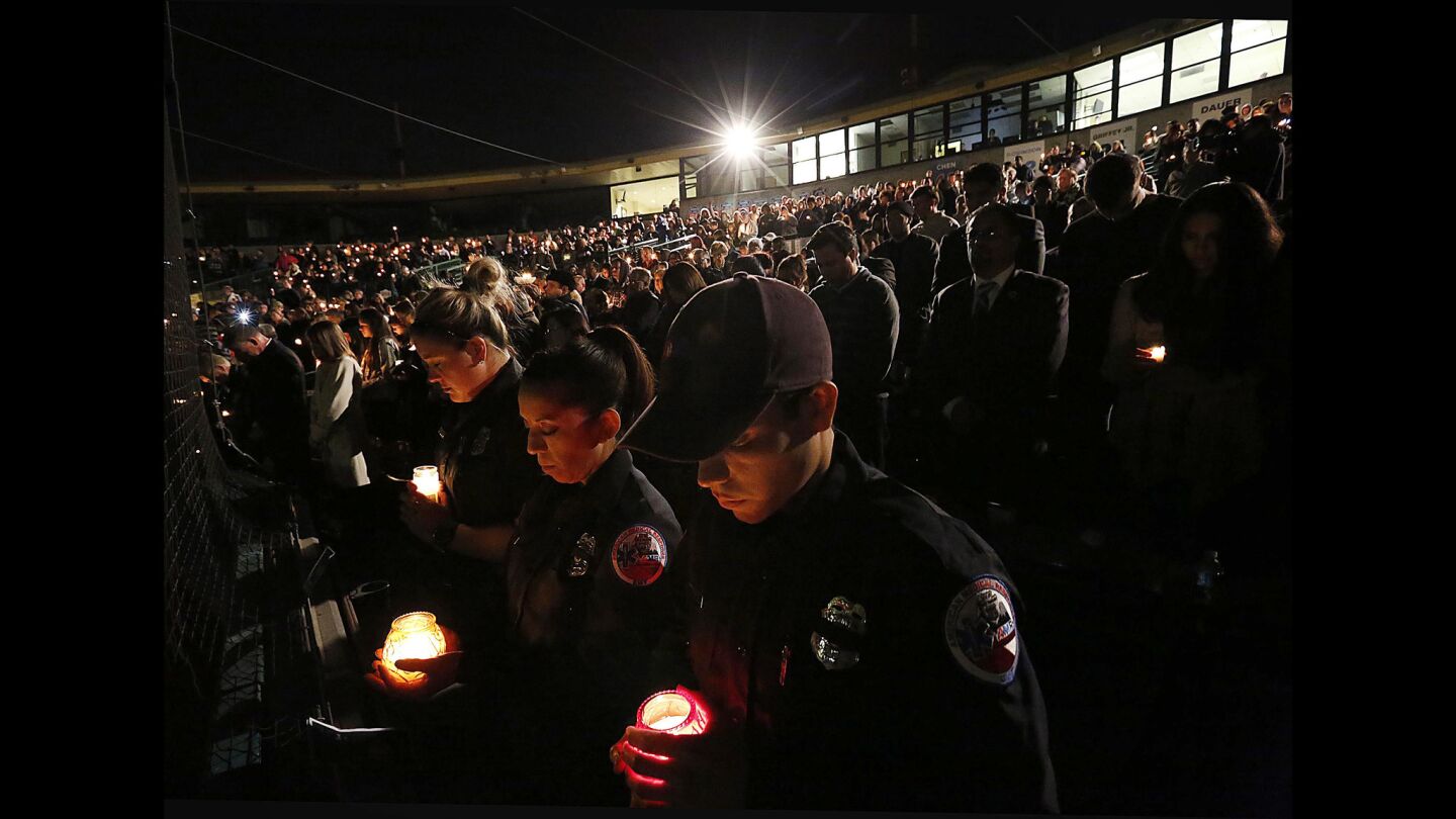 Fabio Ahumada, a San Bernardino EMT, attends a vigil at San Manuel Stadium