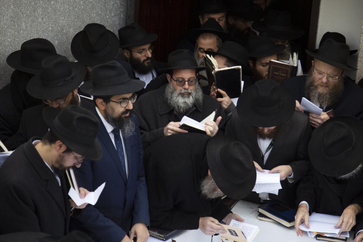 Hasidic leaders gather at the resting place of the late Rabbi Menachem Mendel Schneerson in New York on Friday.