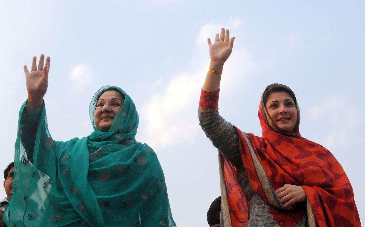 Maryam Safdar, right, and her mother, Kulsoom Nawaz, wave to supporters during an election rally in Lahore in 2013. Safdar, daughter of Pakistani Prime Minister Nawaz Sharif, was named in leaked papers as a trustee or owner of companies based in the British Virgin Islands, a popular tax haven.