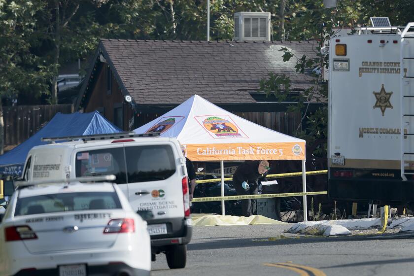 Trabuco Canyon, CA - August 24: Orange County investigators work the scene where a gunman killed three people and six were taken to hospitals after a shooting Wednesday night at Cook's Corner, a landmark biker bar at Cook's Corner in Trabuco Canyon Thursday, Aug. 24, 2023. An Ex-cop is the suspected gunman in mass shooting at O.C. biker bar, sources say; 4 dead, 6 injured. (Allen J. Schaben / Los Angeles Times)