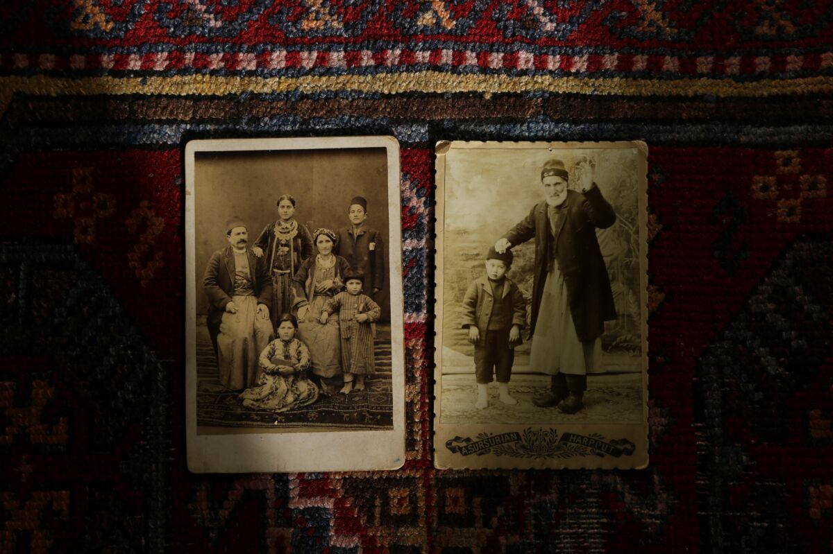 Photos of Sophia Armen's family on her mother's side from Kharpert -- current day Harput, Turkey -- sit on an Ottoman Empire era prayer mat at St. Peter Armenian Apostolic Church.