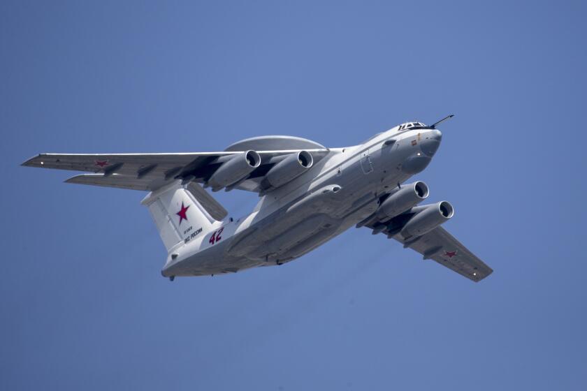 FILE - A Russian Beriev A-50 airborne early warning and control plain flies over Red Square during a rehearsal for the Victory Day military parade in Moscow, Russia, on May 7, 2019. Ukraine’s military chief is claiming that the Ukrainian air force has shot down a Russian Beriev A-50 early warning and control plane and an IL-22 command center aircraft. (AP Photo/Alexander Zemlianichenko, Pool, File)