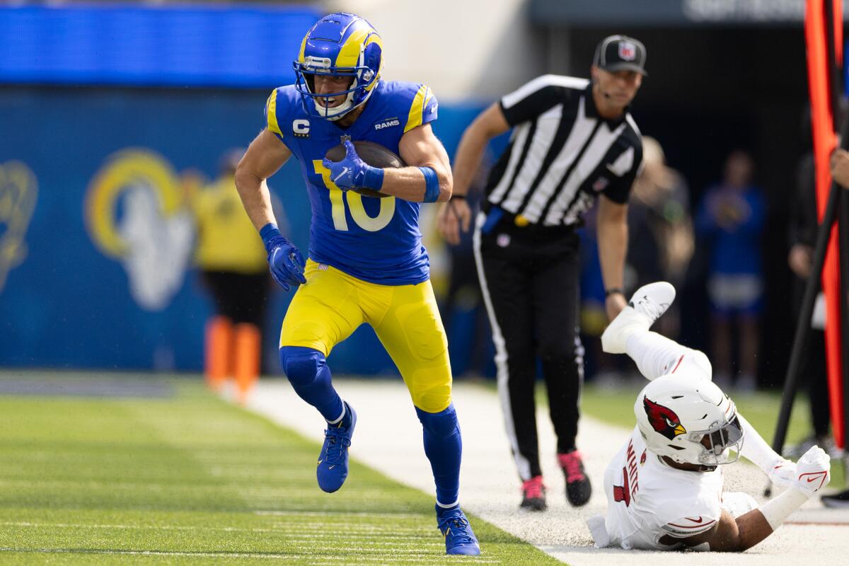 Rams wide receiver Cooper Kupp runs after a catch against the Cardinals.