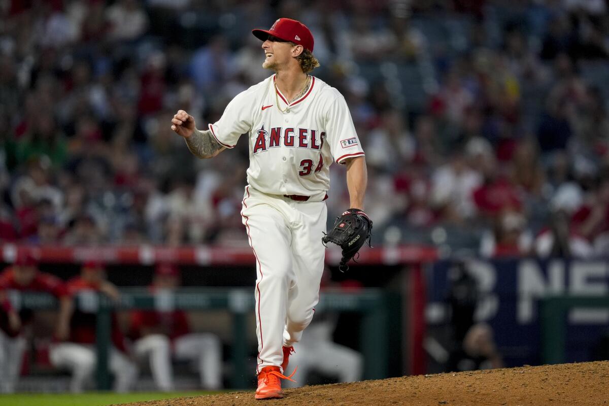 Angels starting pitcher Zach Plesac reacts after making a pitch in the sixth inning.