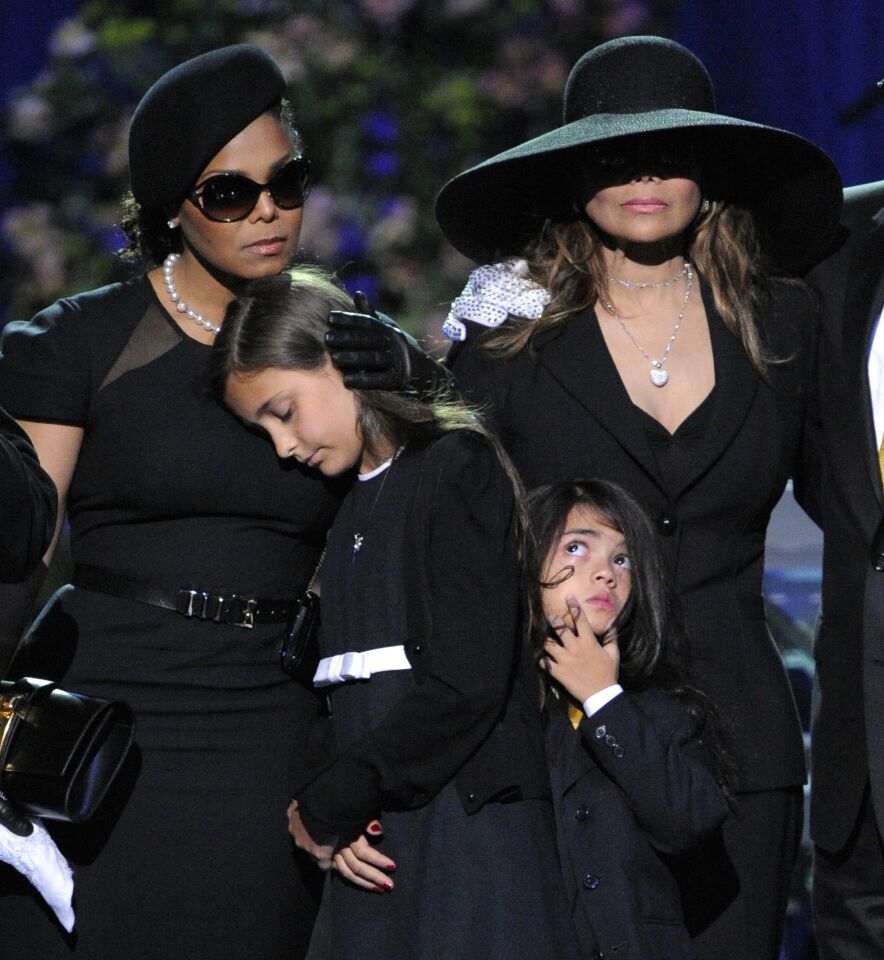 Singer Janet Jackson, left, Paris Katherine Jackson, Prince Michael Jackson II and LaToya Jackson are seen on stage during the memorial service for Michael Jackson at Staples Center in Los Angeles on July 7, 2009.