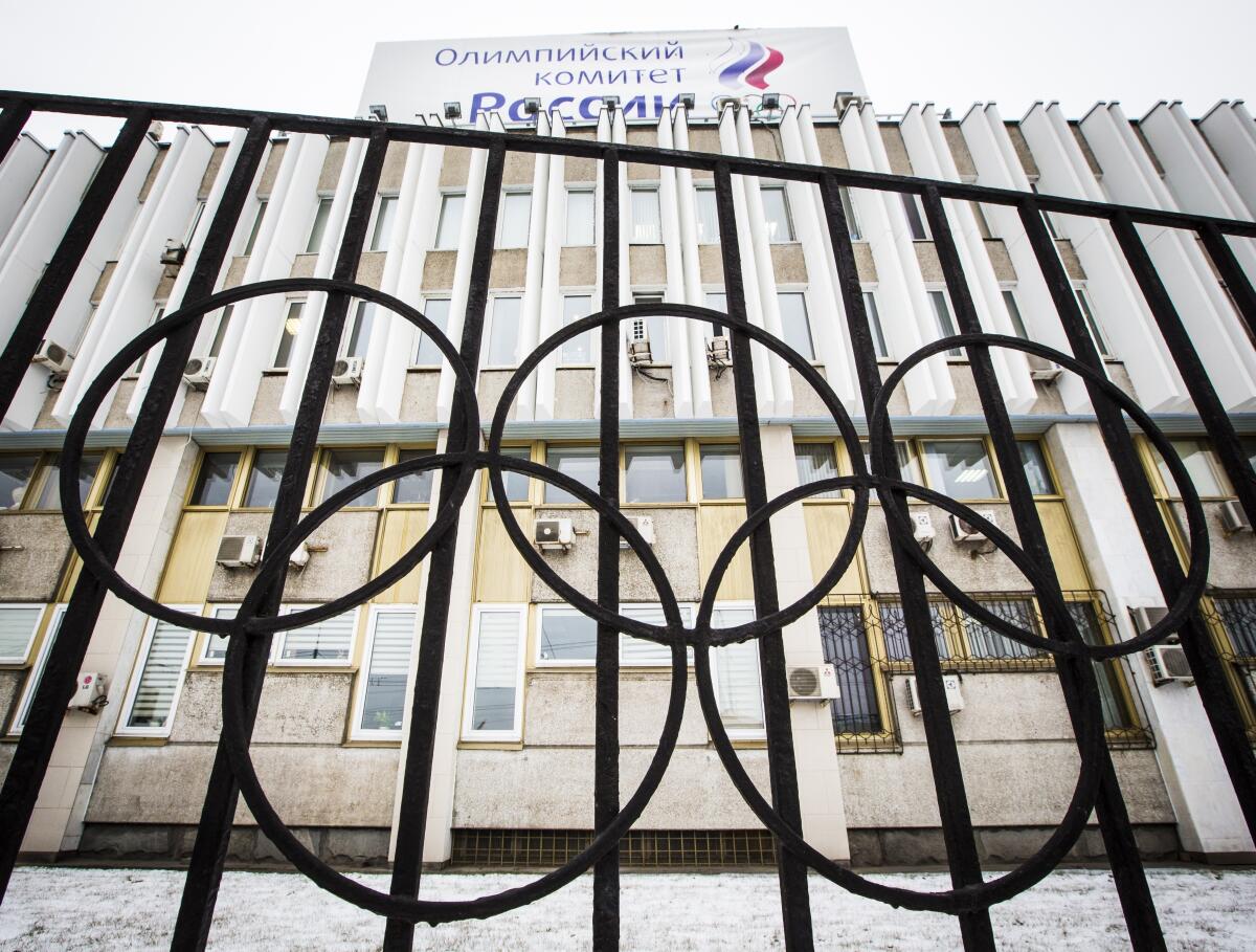 The building of the Russian Olympic Committee is seen through a gate decorated with the Olympic rings in Moscow.