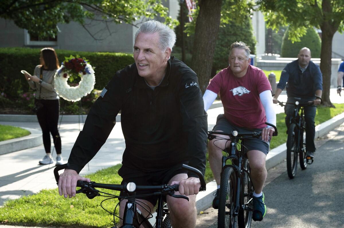 FILE - House Speaker Kevin McCarthy, of Calif., leads fellow members of Congress and law enforcement officers