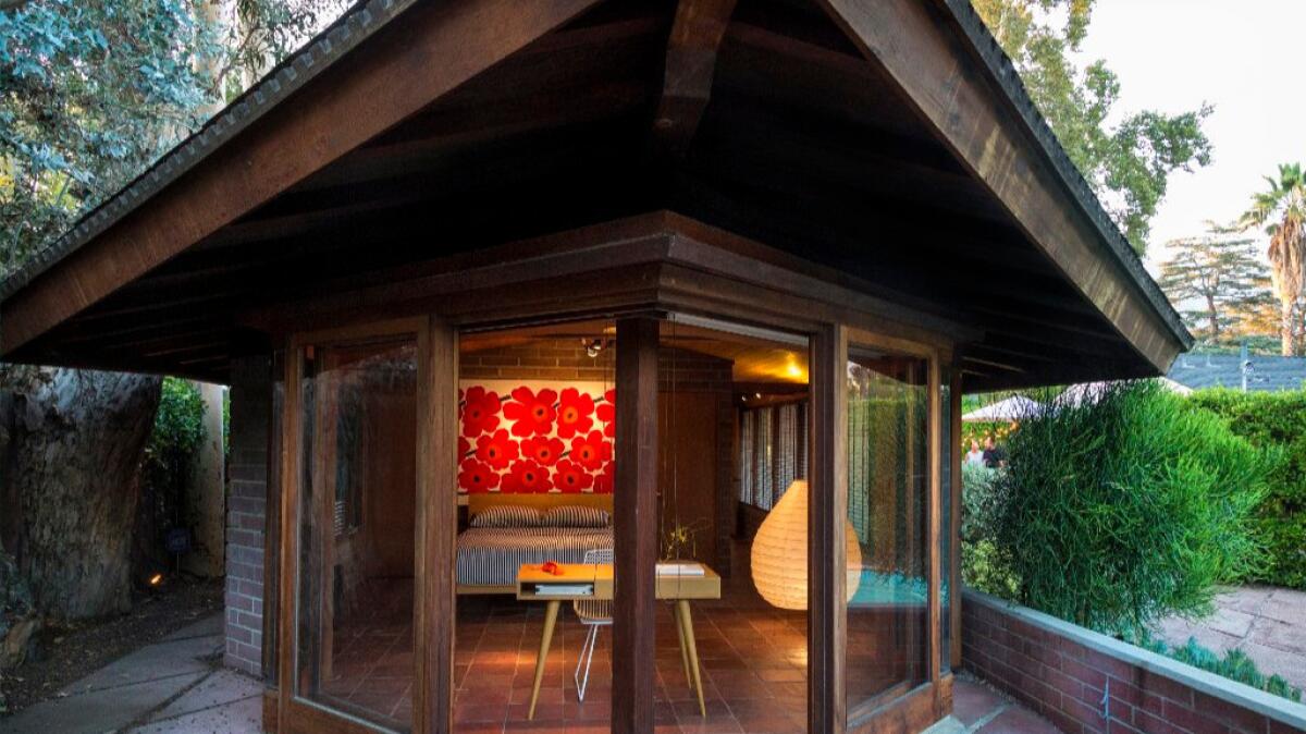 Marimekko textiles and a Noguchi lamp liven up the master bedroom, originally a sleeping porch.