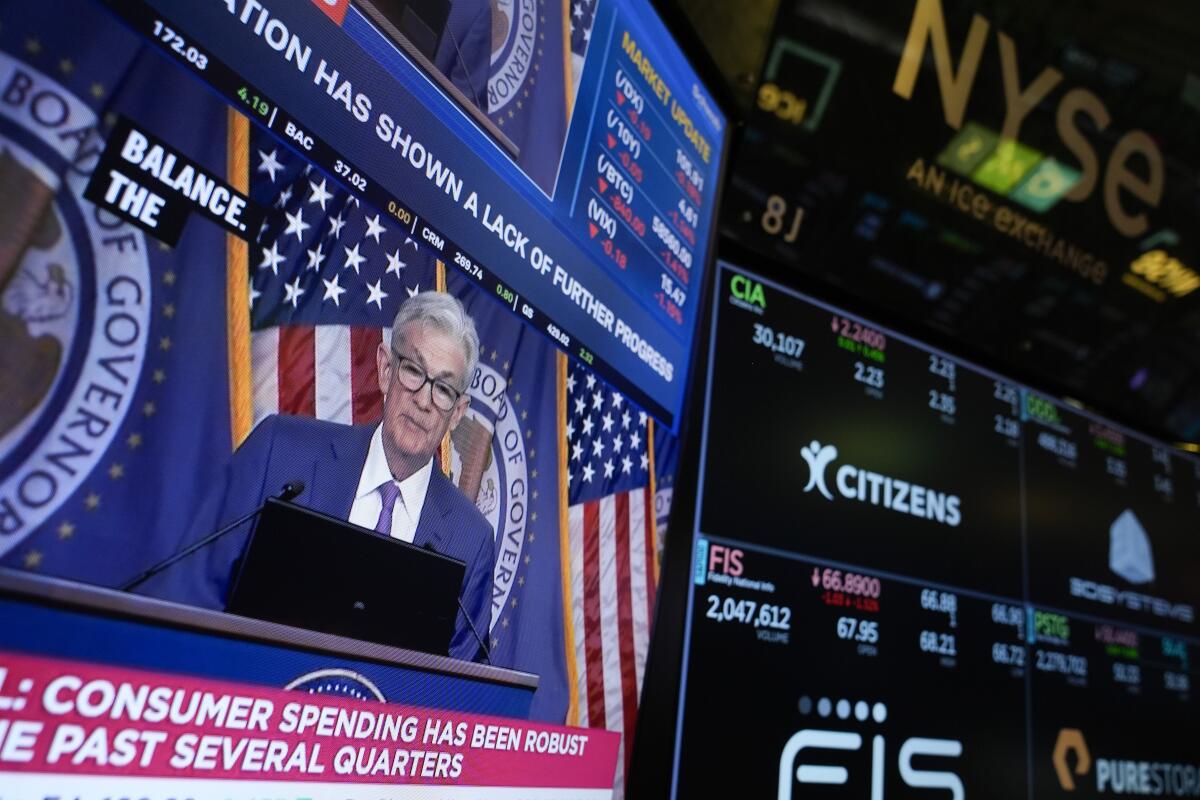 Federal Reserve Chair Jerome Powell on a screen at the New York Stock Exchange. 