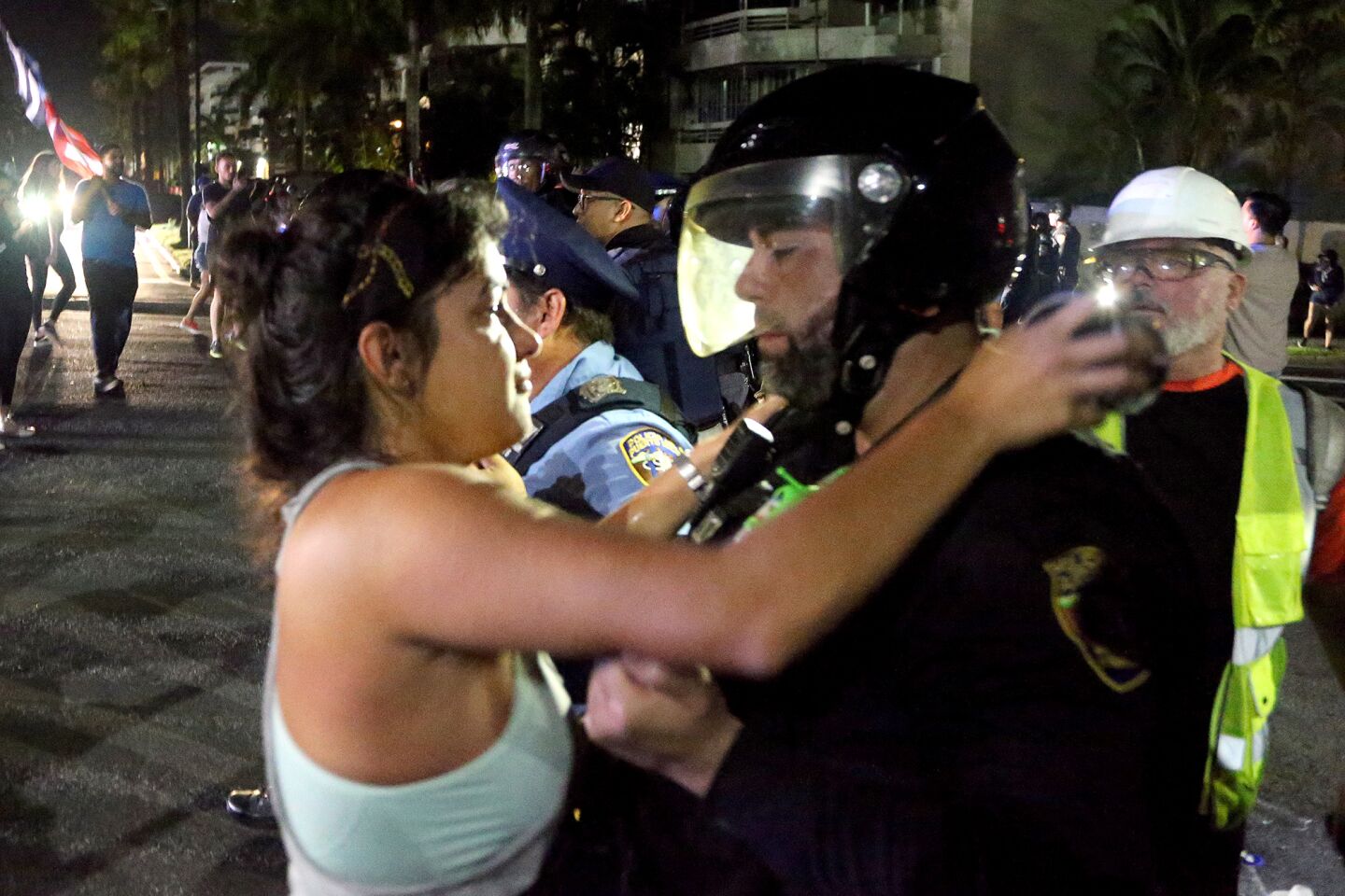 Protester hugs a police officer