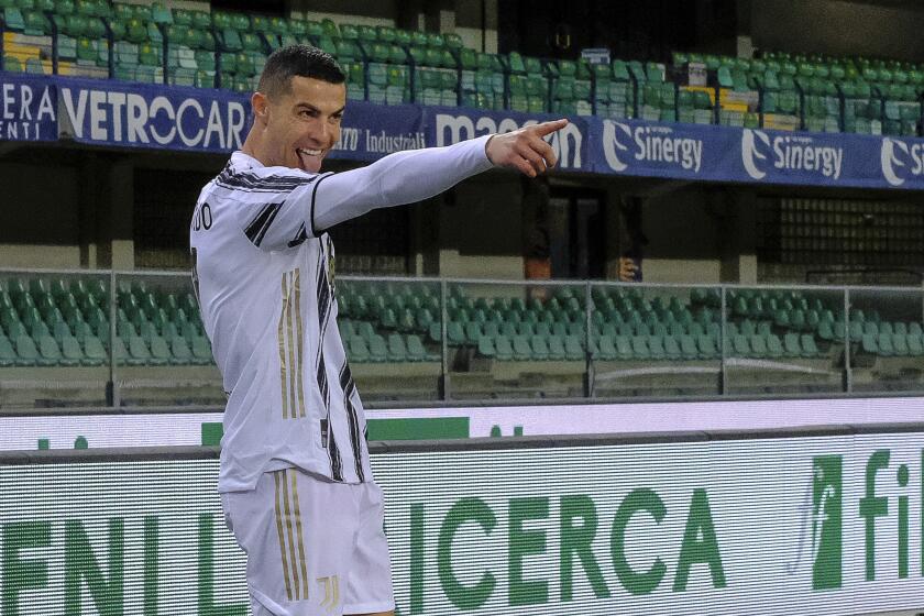 FILE - Cristiano Ronaldo celebrates after scoring a goal during the Italian Serie A soccer match between Verona and Juventus at the Bentegodi stadium in Verona, Italy, on Saturday, Feb. 27, 2021. Juventus has been ordered to pay Cristiano Ronaldo more than $10 million by an arbitration board following a salary dispute with one of his former clubs. The dispute regarded a move by Juventus players to defer part of their salaries during the coronavirus pandemic. (Paola Garbuio/LaPresse via AP, File)