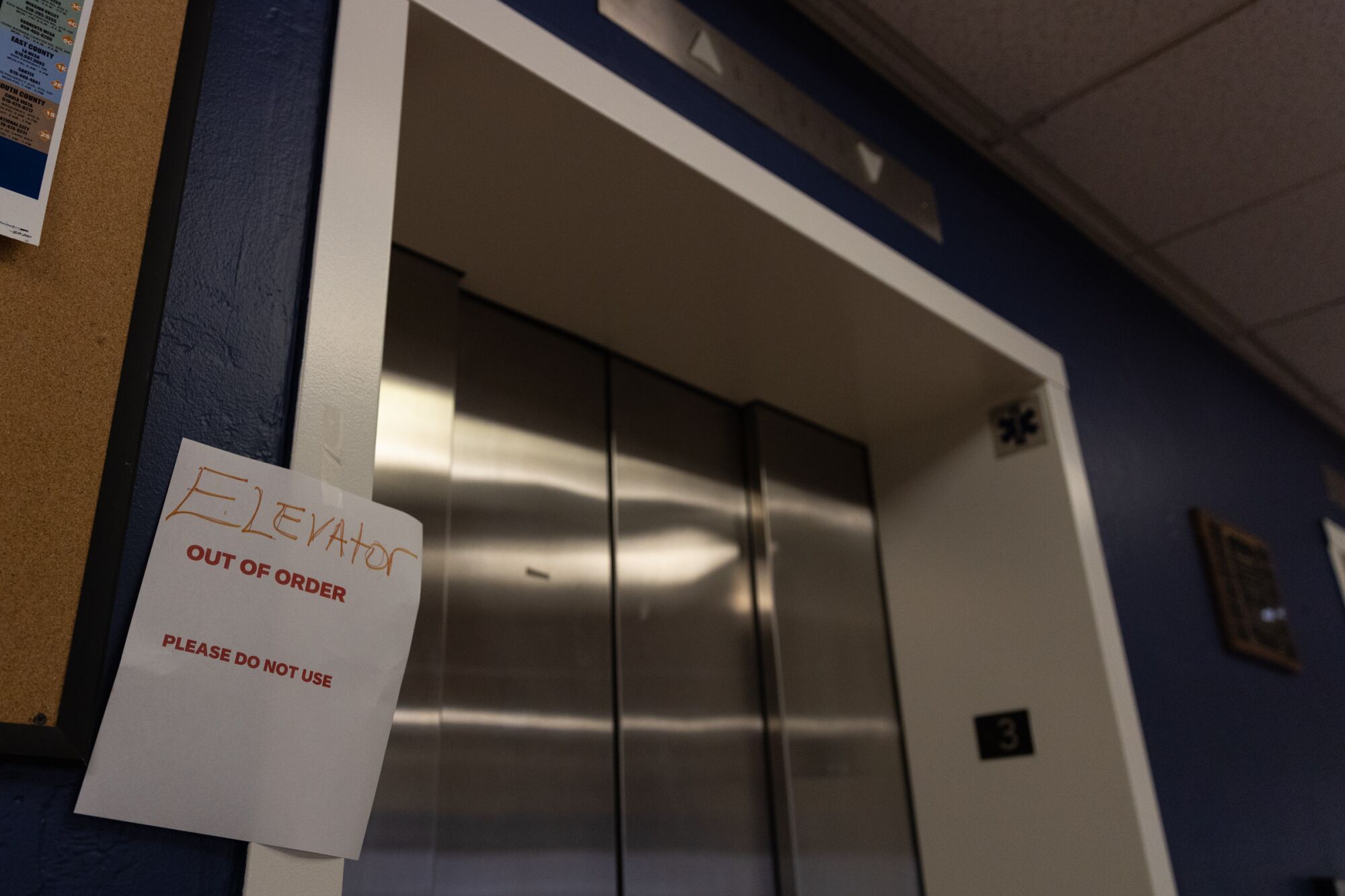 An out of order sign is seen posted at an elevator at the City Operations Building.