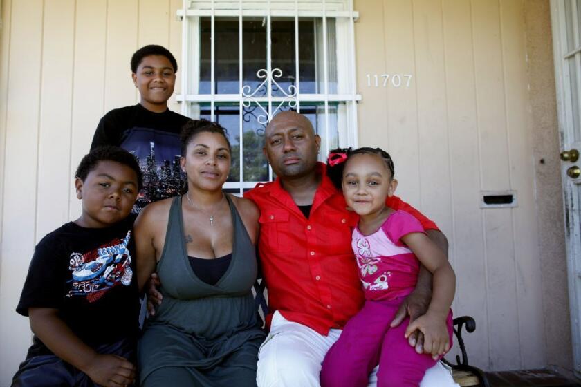 California has picked an auditor to review mortgage servicing by Ocwen Financial. Above, Tyesha Hansborough and husband Christley Paton, with children Chyler, Christley Jr. and Meelah, said they lost insurance on their home in Inglewood because of an Ocwen mixup.