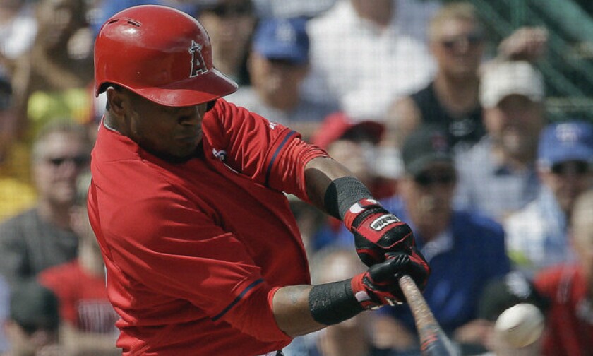 Angels shortstop Erick Aybar hits a two-run double during an exhibition game against the Chicago White Sox on Thursday. Aybar had two hits in Sunday's Cactus League loss to the Seattle Mariners.