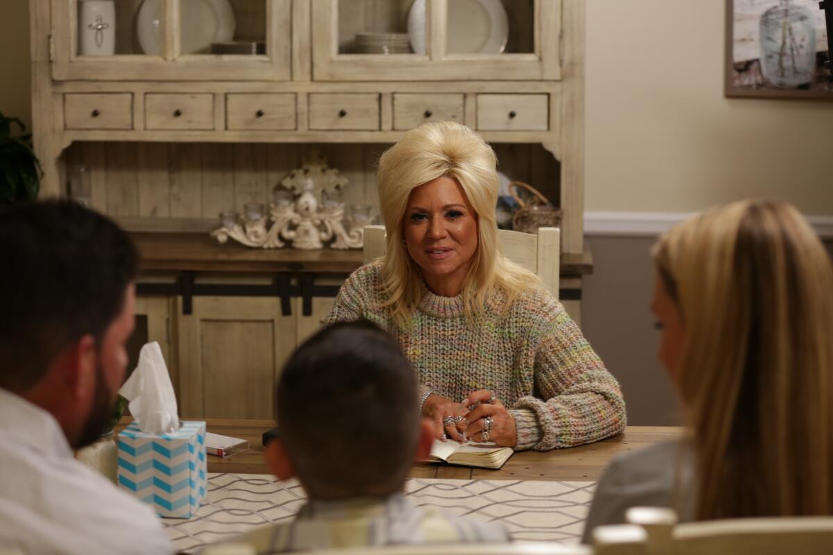 Medium Theresa Caputo gives a reading for Renee, Peter and their young son, Matthew in an episode of “Long Island Medium.”
