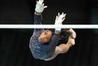 U.S. gymnast Simon Biles goes through her uneven bars routine during podium training ahead of the 2024 Olympics in Paris