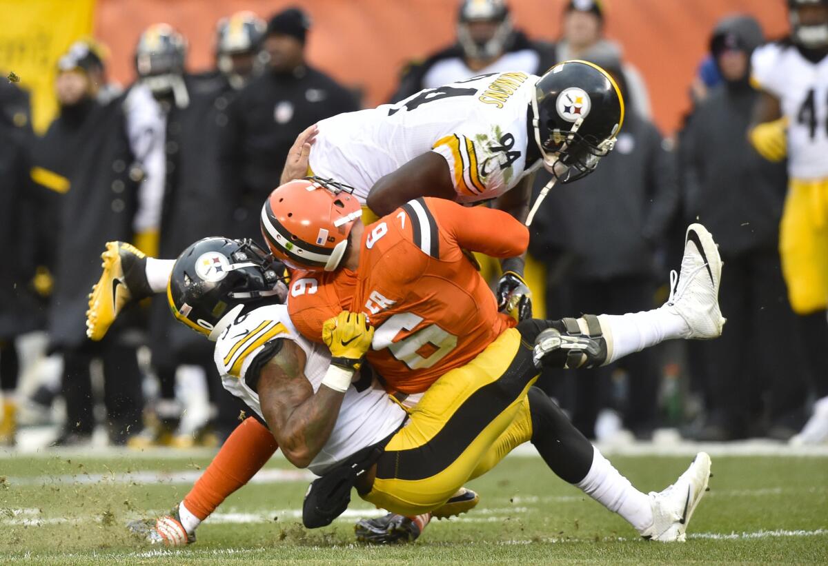 Steelers inside linebacker Lawrence Timmons (94) hits Cleveland Browns quarterback Cody Kessler (6) as Kessler is tackled by inside linebacker Ryan Shazier (50) in the third quarter on Nov. 20.