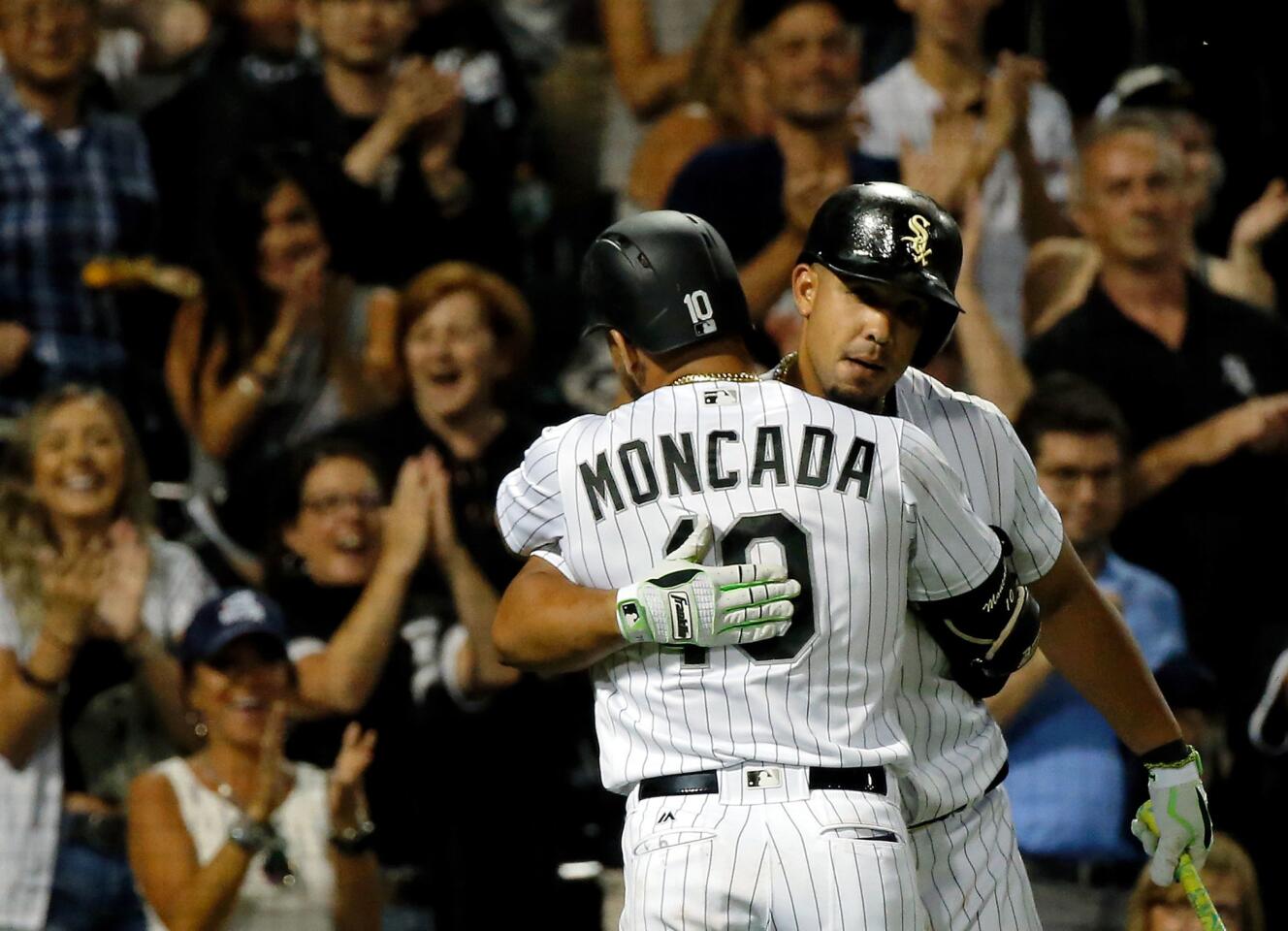 Yoan Moncada is hugged by Jose Abreu after hitting a home run against the Astros to tie the game during the ninth inning on Aug. 10, 2017.