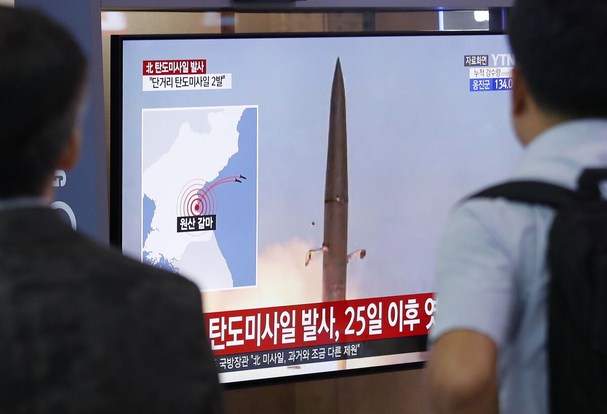 At a train station in Seoul, people watch a television broadcast of North Korea's missile launch on July 31, 2019, when the South Korean military announced North Korea had fired two short-range ballistic missiles off its east coast.